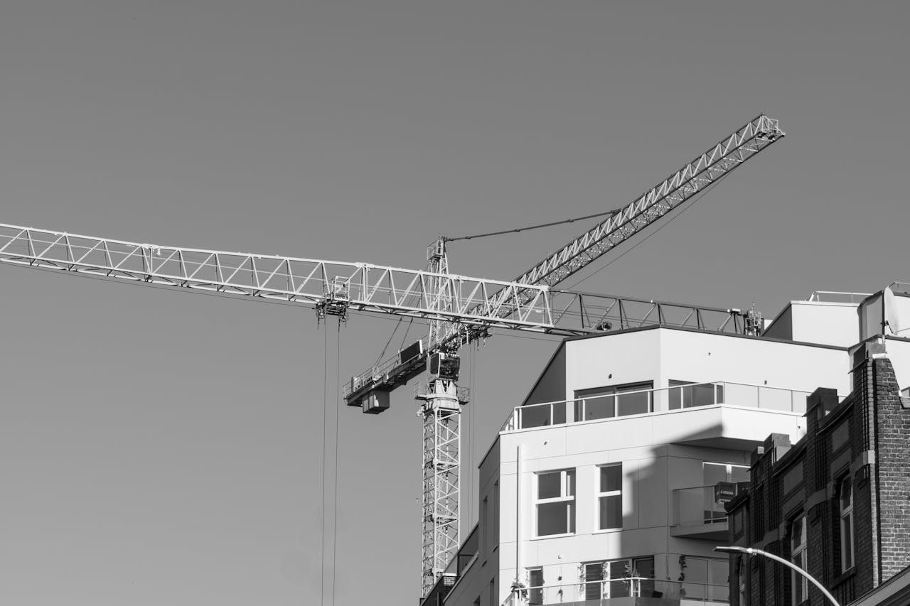 services-06 A modern crane over a building in Liège, Belgium. Black and white architecture shot.